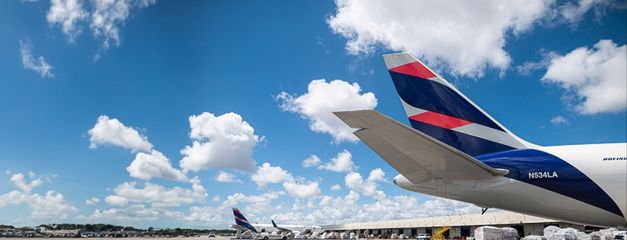 LATAM aircraft tail against a blue sky